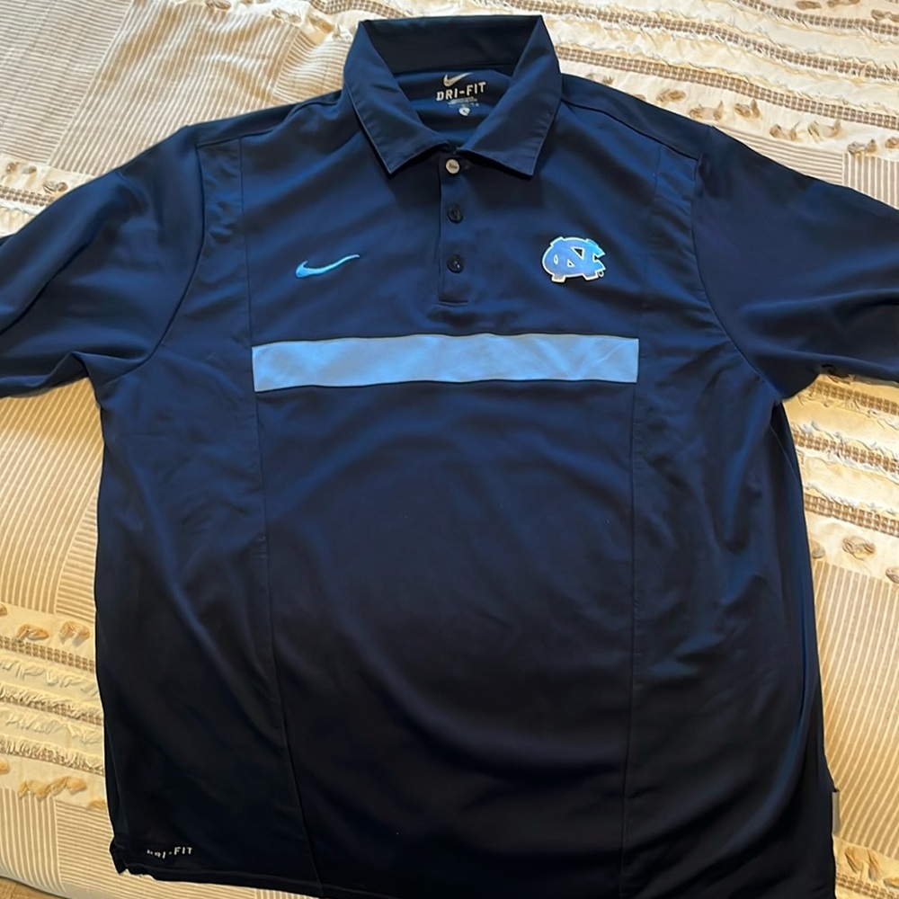 Men’s Nike dri-fit polo with Carolina logo.